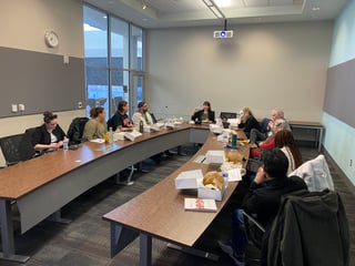 students seated around conference table