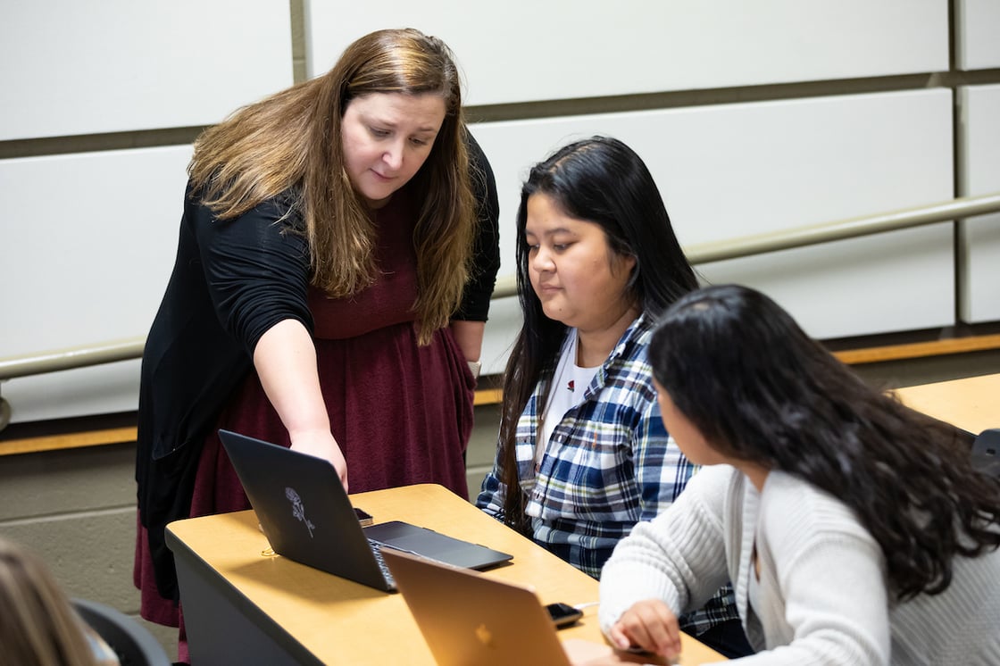 Laurel Sariscsany works with a student in her classroom