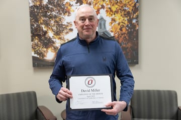 David Miller, Business Operations Coordinator for Academic Affairs, poses for a photo as UNO's April Employee of the Month.