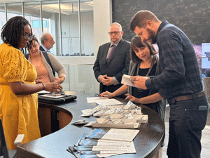 group gathered around check-in table