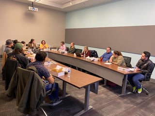 students seated around conference table