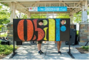 Omaha Summer Arts Festival painted logo sign