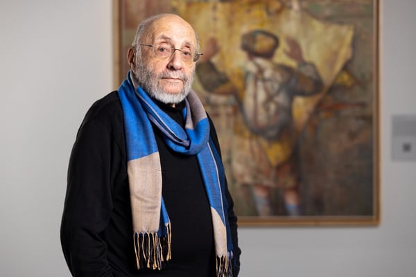 Samuel Bak Portrait in front of his painting Icon of Loss, Identity