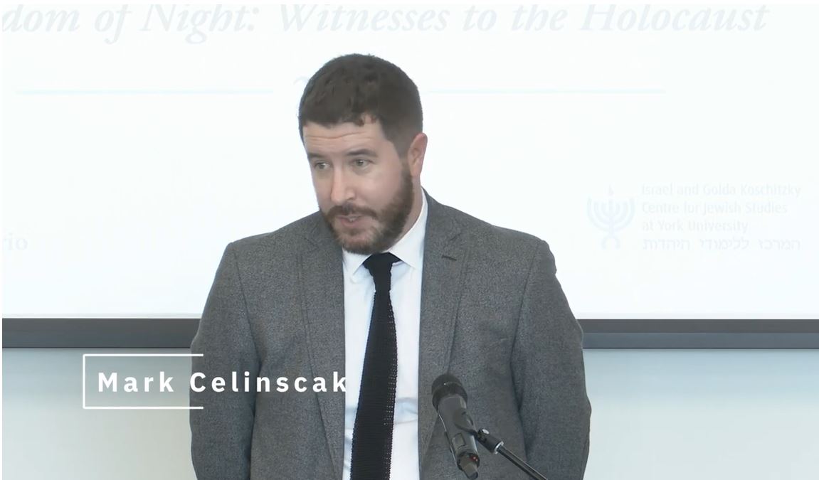 Mark Celinscak stands in front of a podium