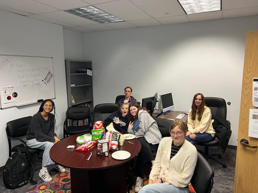 members of the History Club seated around a table