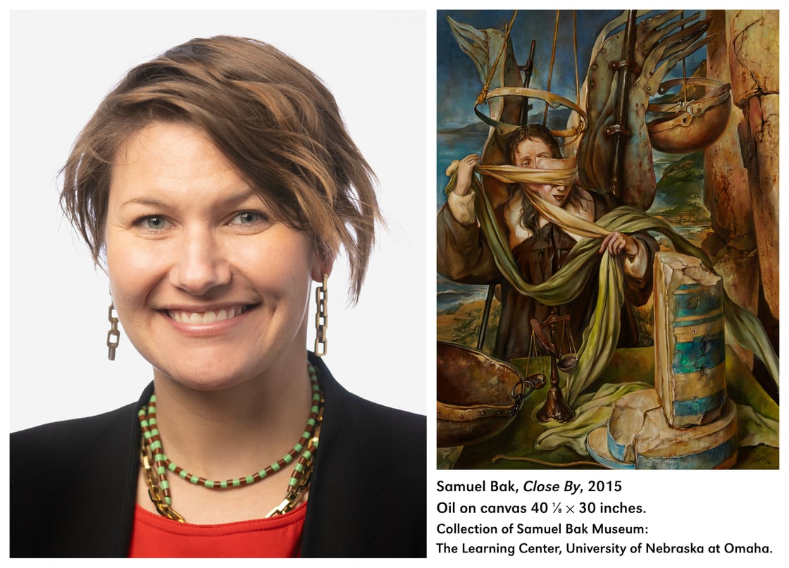 Lauren Foster next to Samuel Bak’s "Close By," featuring a mechanical, draped Lady Justice.