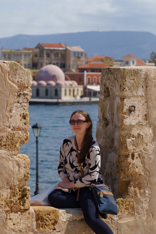 Lowderman, sits on a wall by the sea