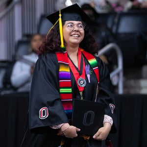  commencement student with degree and stole SQ
