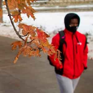 Fall student leaves coat snow
