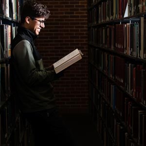 student reading books