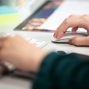 person typing on computer closeup