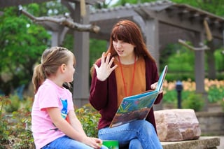 student reading to girl