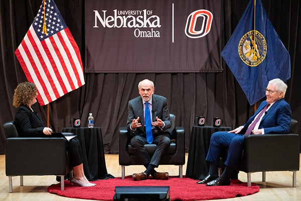 Obradovic, Seib, and Hagel speaking on stage