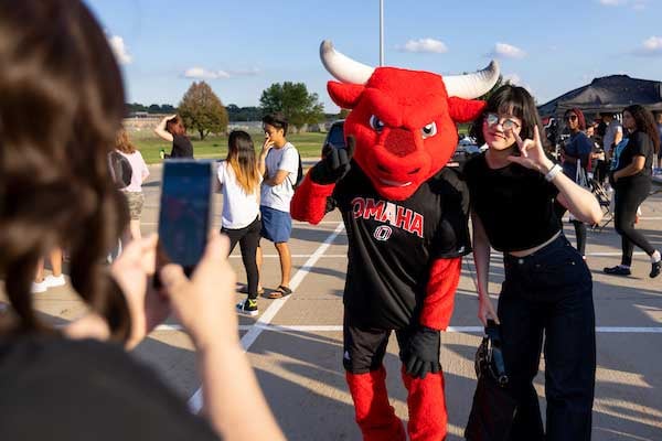 Durango and a student pose for a photo at MavFEST