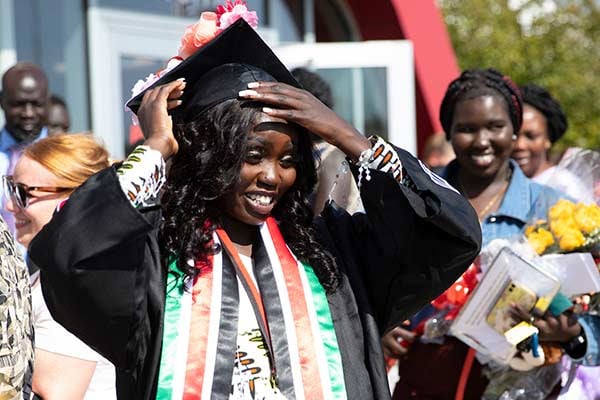 Alakiir Mapior adjusts her graduation cap
