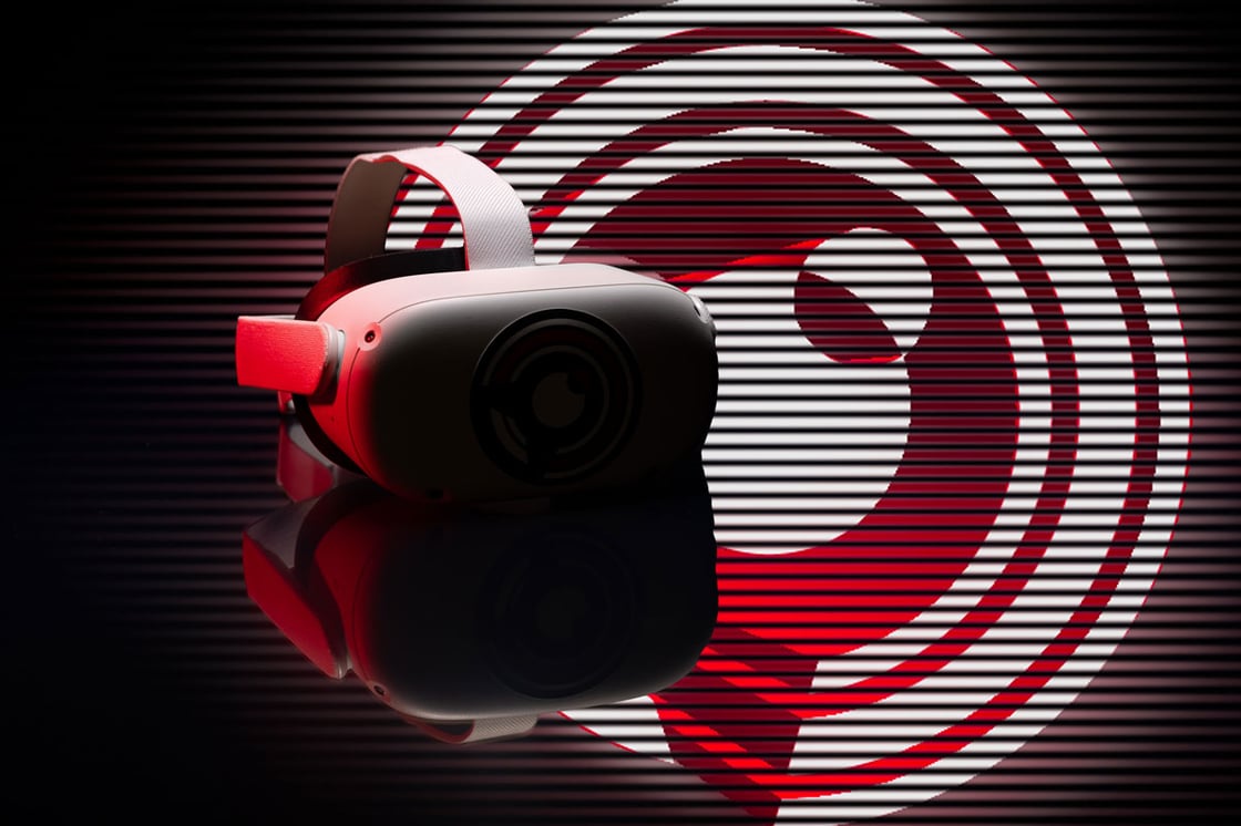 A darkened image of a VR headset with a red illuminated NCITE birdie logo behind it. 