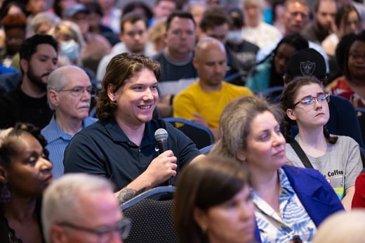 audience participant asks Kathleen Belew a question