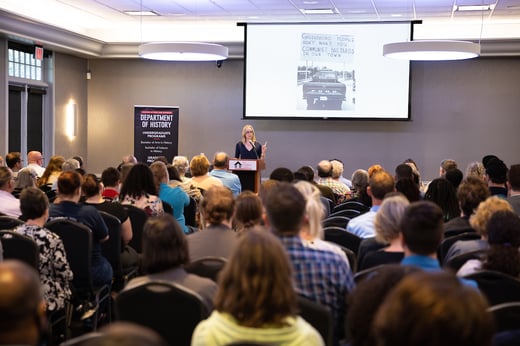 Dr. Kathleen Belew speaks to a crowd