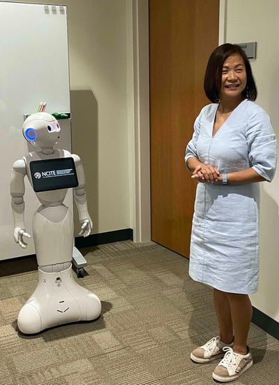 Chancellor Jo Li with Pepper the robot