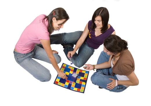friends playing board games over a white background