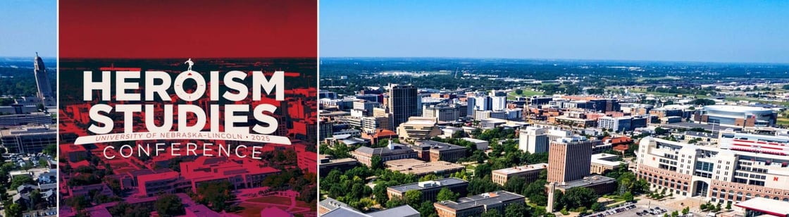A sunny sky-blue, aerial view of a city landscape. On the left is a red translucent square with the words “Heroism Studies Conference” in white text. In between the words “Studies” and “Conference” is a narrow white banner with the words “University of Nebraska – 2025” in red text.