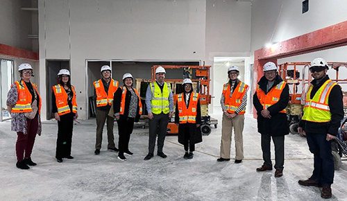 Photo of Dr. Li and others in renovated Roskens Hall site