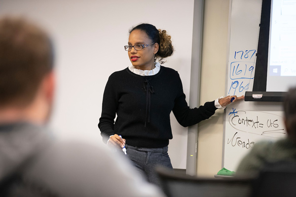 UNO faculty member teaching a class